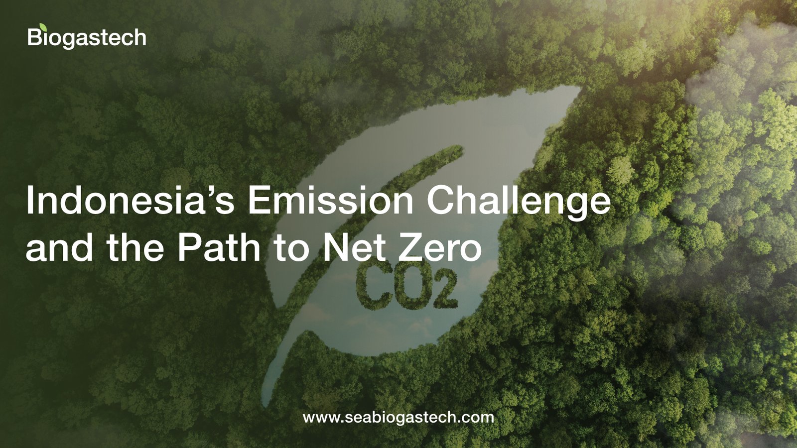 An aerial, top-down photograph of a dense, lush green forest. In the center of the image, the trees are cleared or shaped to form the silhouette of a large leaf. Inside the leaf shape, there is a body of water reflecting a clear sky, with the chemical formula "CO2" rendered in a dark, mossy texture floating in the center of the water. The image contains several text elements: Top Left: The logo for "Biogastech" in white. Center: Large, bold white text that reads: "Indonesia’s Emission Challenge and the Path to Net Zero." Bottom Center: The website URL "www.seabiogastech.com" in a smaller white font. The overall mood is environmental and focused on sustainability, using the contrast between the green canopy and the water to highlight the theme of carbon emissions. Biogas